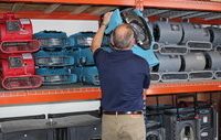 Water Damage Restoration Technician Prepping Air Movers